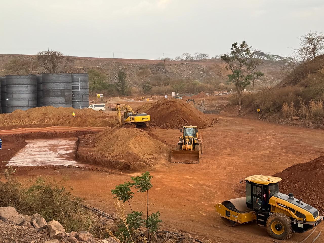 Earthmoving equipment preparing the plant site
