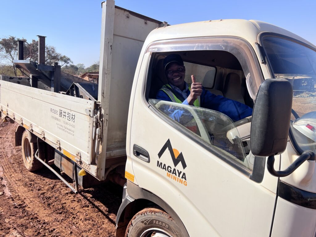 Magaya Mining Truck with employee in steering wheel